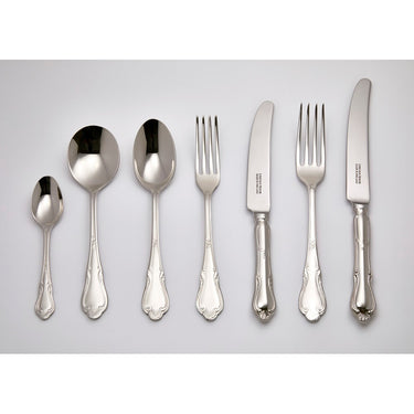 Set of cutlery including spoons, forks, and knives on a gray background