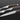 Walnut handled knife, fork, and spoon on table