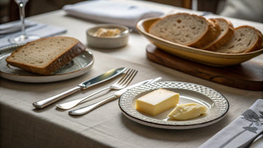 Editorial hero image illustrating The Complete Guide to Bread and Butter Plates: Sizes, Styles and How to Use Them for a Cutlery e-commerce brand.