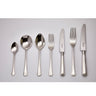Set of silver cutlery including spoons, forks, and knives on a light gray background
