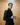Man in suit holding silver tankard